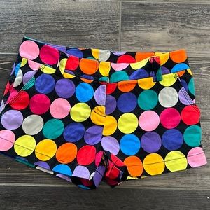 Brightly colored, rainbow polka dot shorts